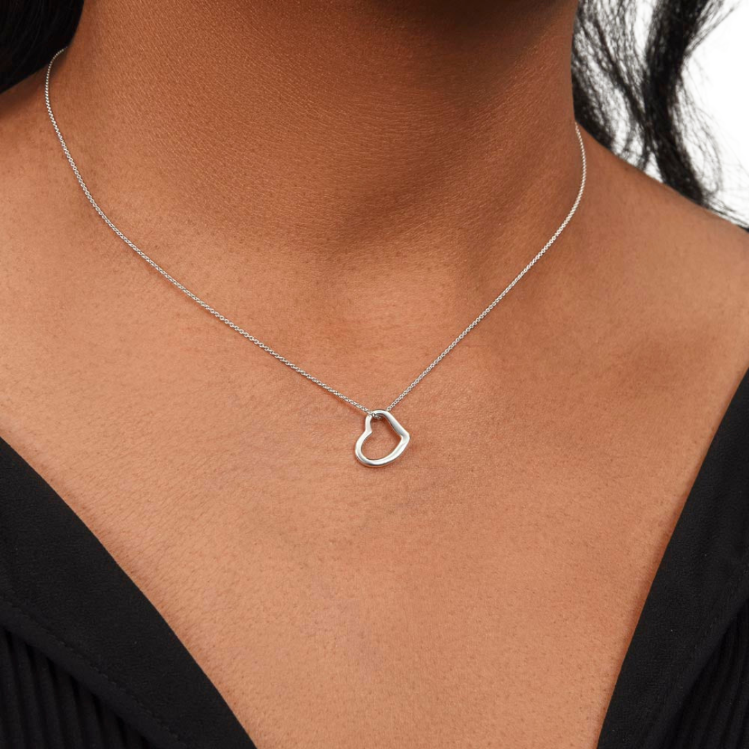 Imagine her delight when she sees this beautiful Delicate Heart Necklace, lovingly crafted in sterling silver and dipped in 14k white gold or 18k yellow gold for added luxury. This piece is pure elegance wrapped up in timeless simplicity. Trends may come and go, but this piece will last a lifetime with its classic subtle beauty.