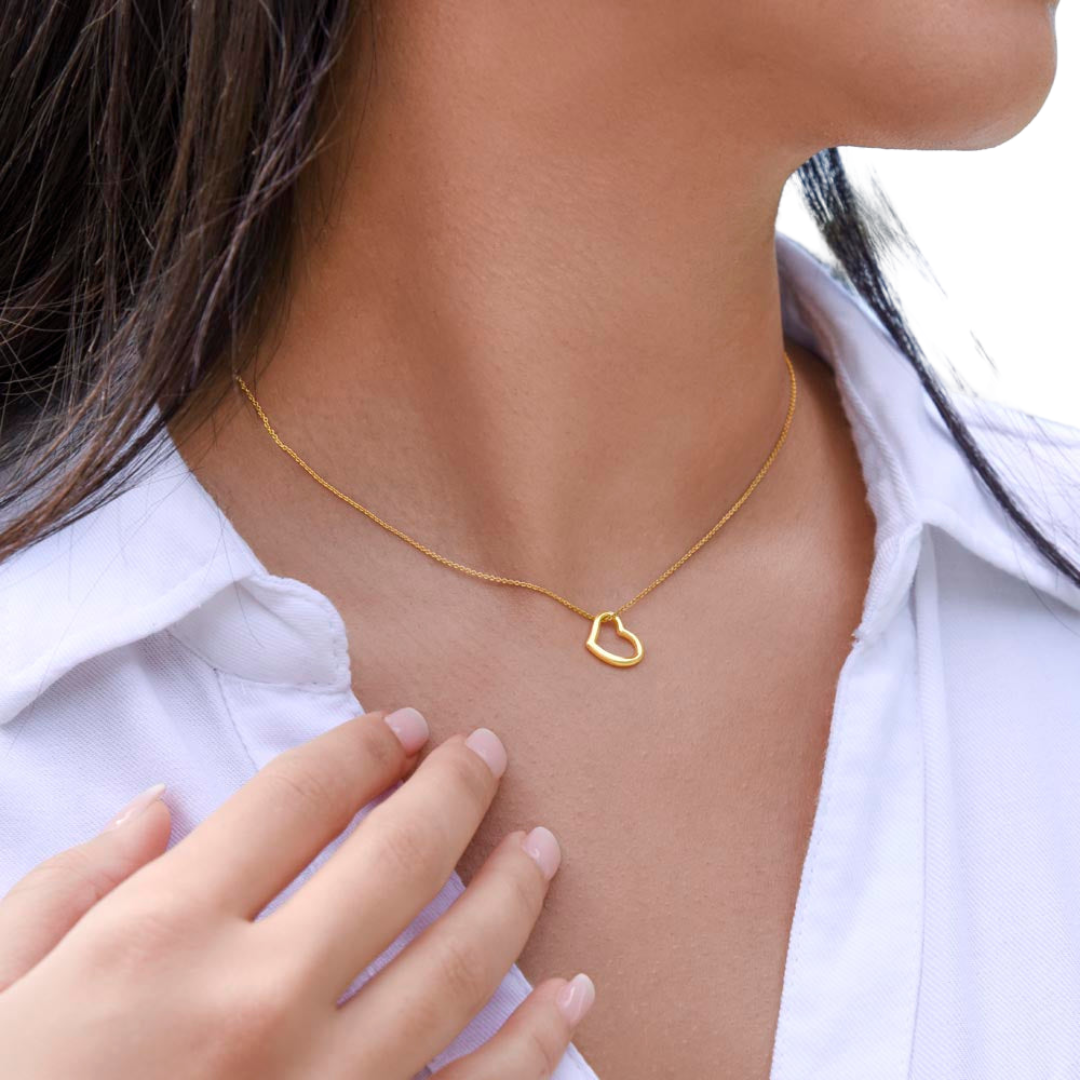 Imagine her delight when she sees this beautiful Delicate Heart Necklace, lovingly crafted in sterling silver and dipped in 14k white gold or 18k yellow gold for added luxury. This piece is pure elegance wrapped up in timeless simplicity. Trends may come and go, but this piece will last a lifetime with its classic subtle beauty.