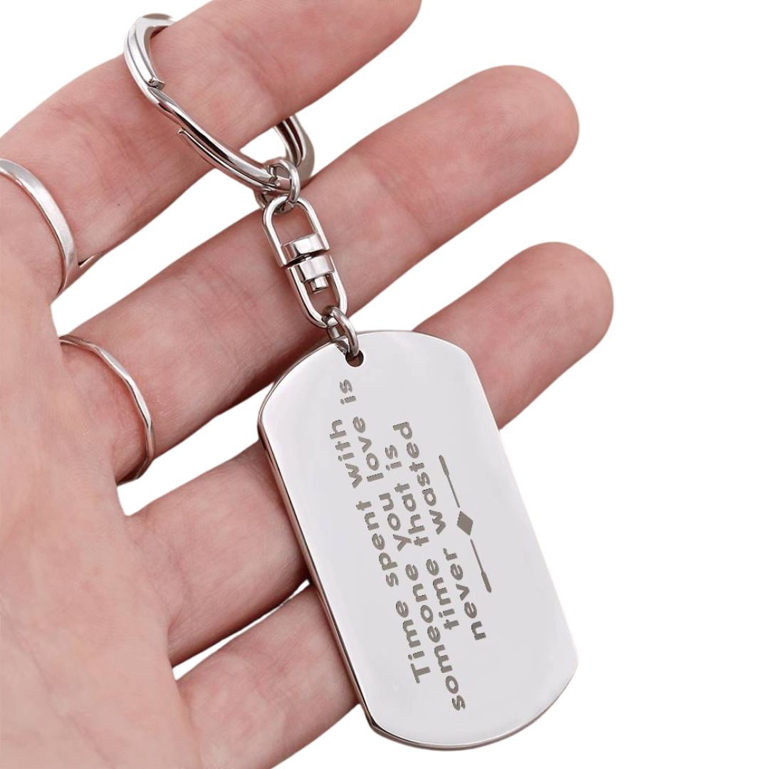 Create a unique keepsake with our Engraved Dog Tag Keychain. This high-quality stainless steel piece can be customized on the back in a scripted font, with 2 lines of text, up to 20 characters each.