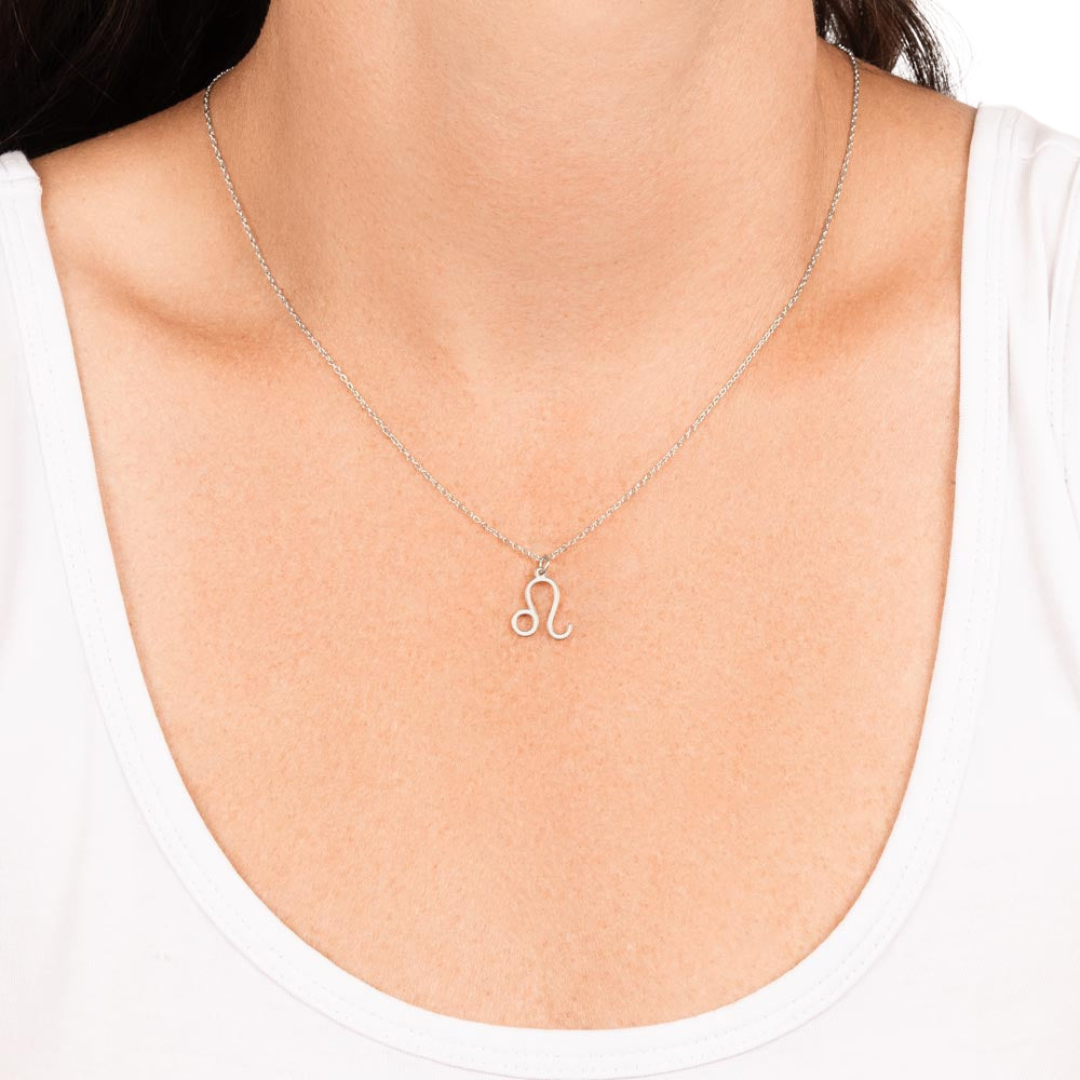 Leo Zodiac Name Necklace. Handcrafted with care, this piece is made from durable stainless steel and optionally dipped in 18k yellow gold and features her unique astrological sign.