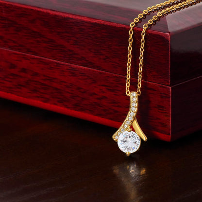 Imagine her reaction when she opens this stunning gift! The Alluring Beauty necklace features a petite ribbon shaped pendant that is sure to dazzle your special someone. Whether it's a birthday or anniversary, make sure to get her a gift she will love for years to come.