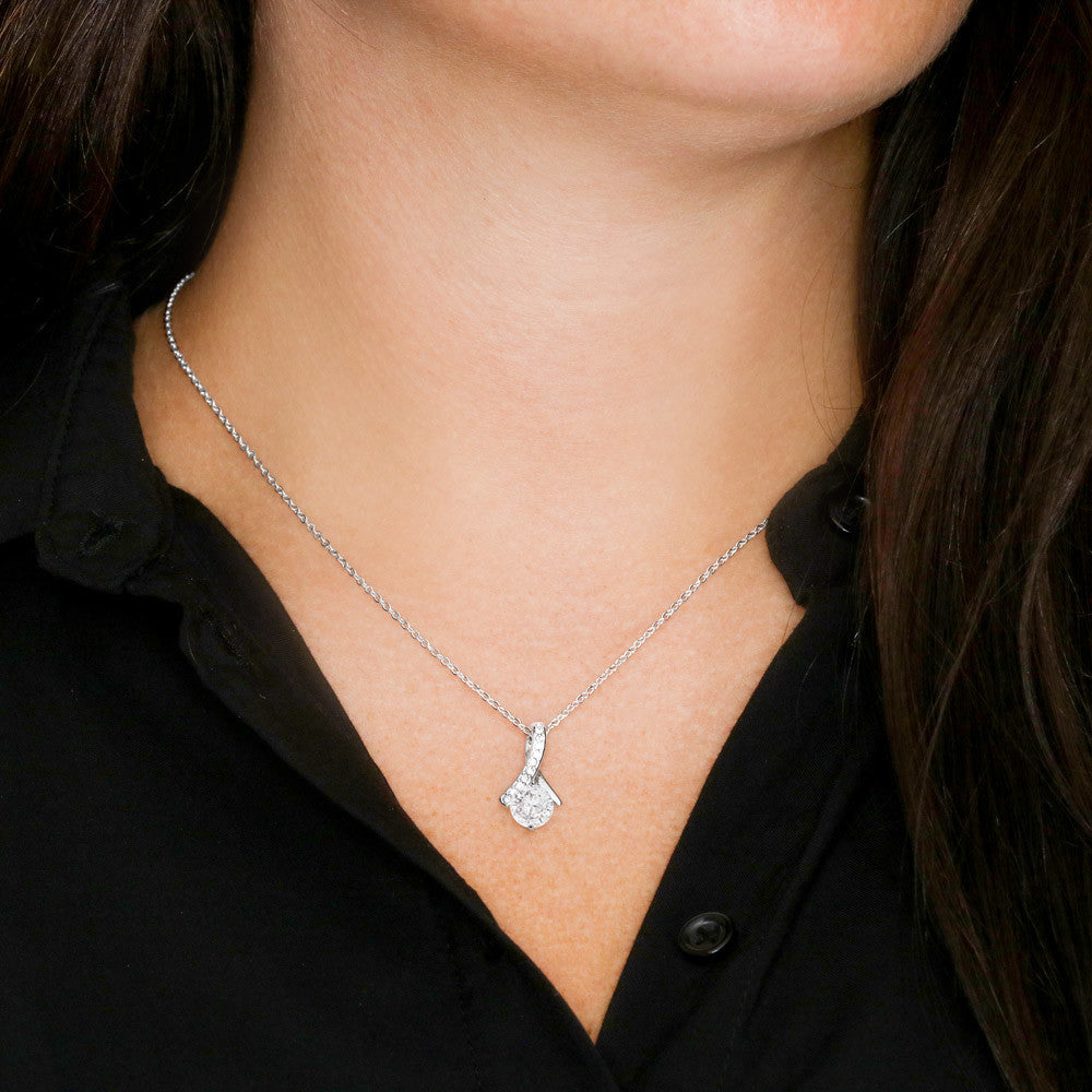 Imagine her reaction when she opens this stunning gift! The Alluring Beauty necklace features a petite ribbon shaped pendant that is sure to dazzle your special someone. Whether it's a birthday or anniversary, make sure to get her a gift she will love for years to come.