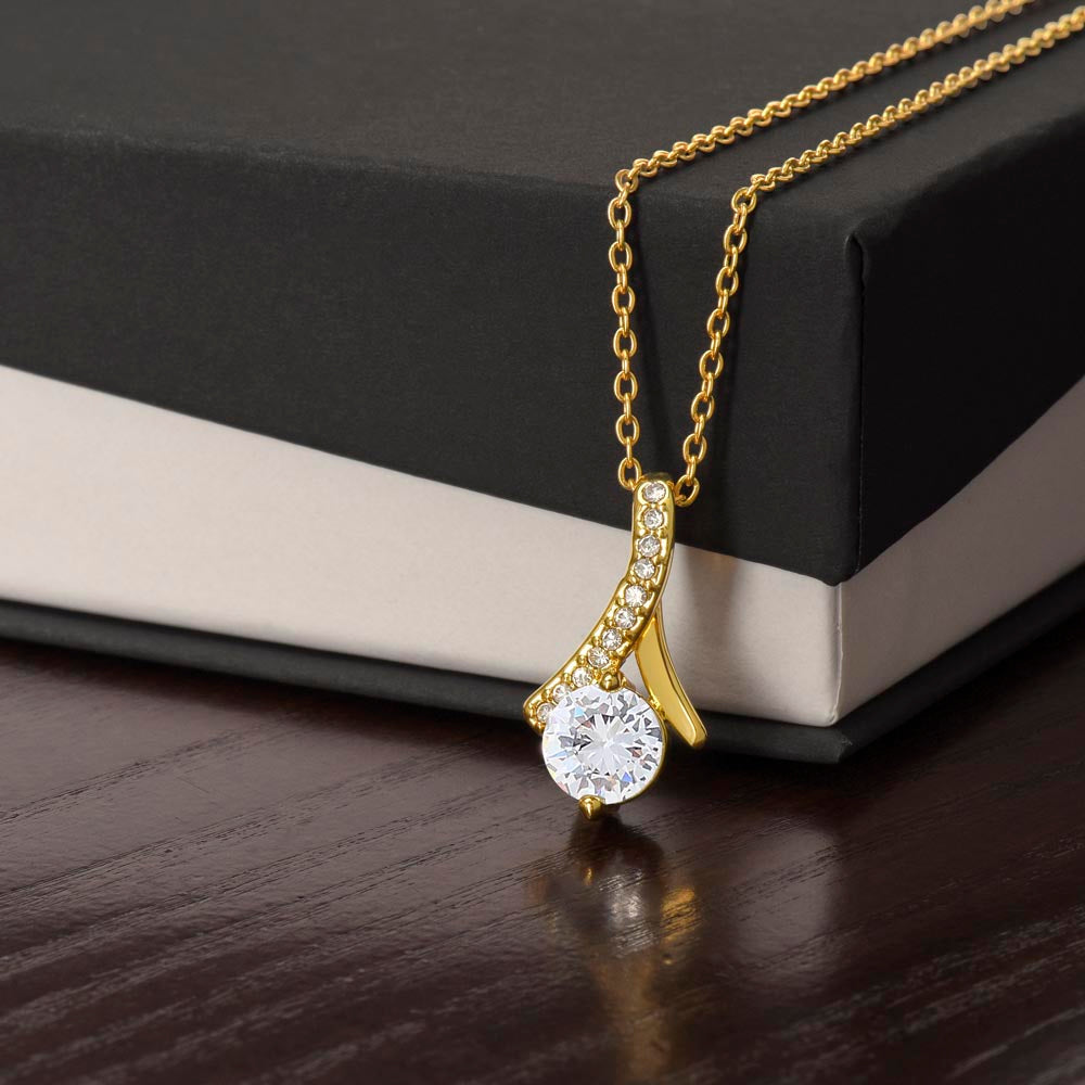 Imagine her reaction when she opens this stunning gift! The Alluring Beauty necklace features a petite ribbon shaped pendant that is sure to dazzle your special someone. Whether it's a birthday or anniversary, make sure to get her a gift she will love for years to come.