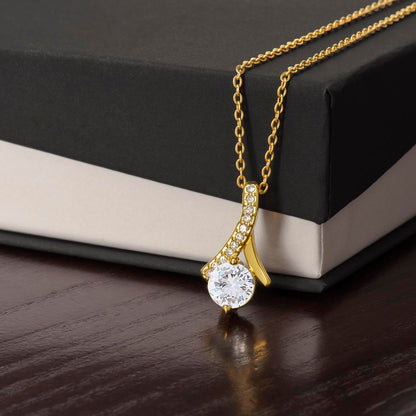Imagine her reaction when she opens this stunning gift! The Alluring Beauty necklace features a petite ribbon shaped pendant that is sure to dazzle your special someone. Whether it's a birthday or anniversary, make sure to get her a gift she will love for years to come.