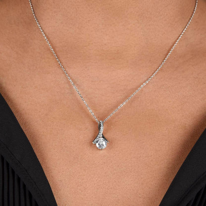Imagine her reaction when she opens this stunning gift! The Alluring Beauty necklace features a petite ribbon shaped pendant that is sure to dazzle your special someone. Whether it's a birthday or anniversary, make sure to get her a gift she will love for years to come.