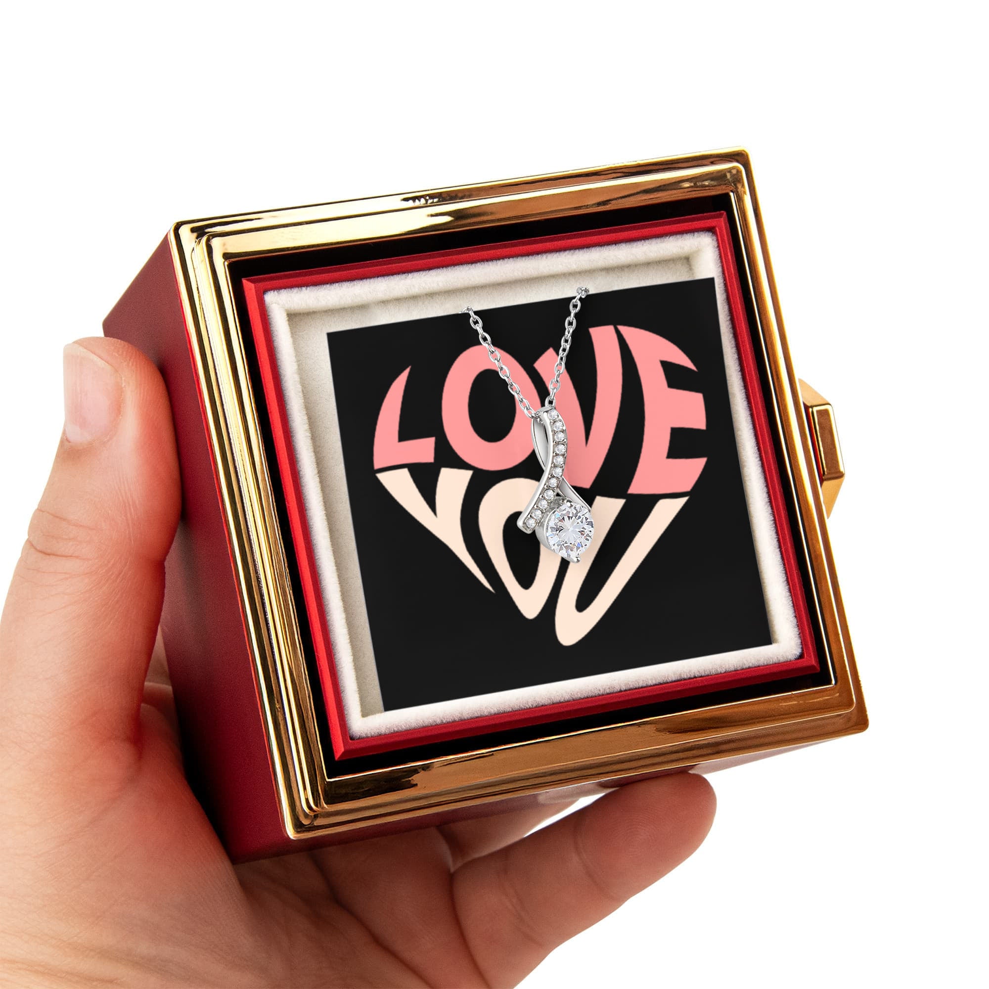 Imagine her reaction as she receives this beautiful Alluring Beauty Necklace. The luxurious box, featuring a charming preserved rose that never fades, adds an extra touch of love. With a simple turn of the gold knob, her breathtaking gift is revealed—making it the perfect sentimental gift for that special someone.