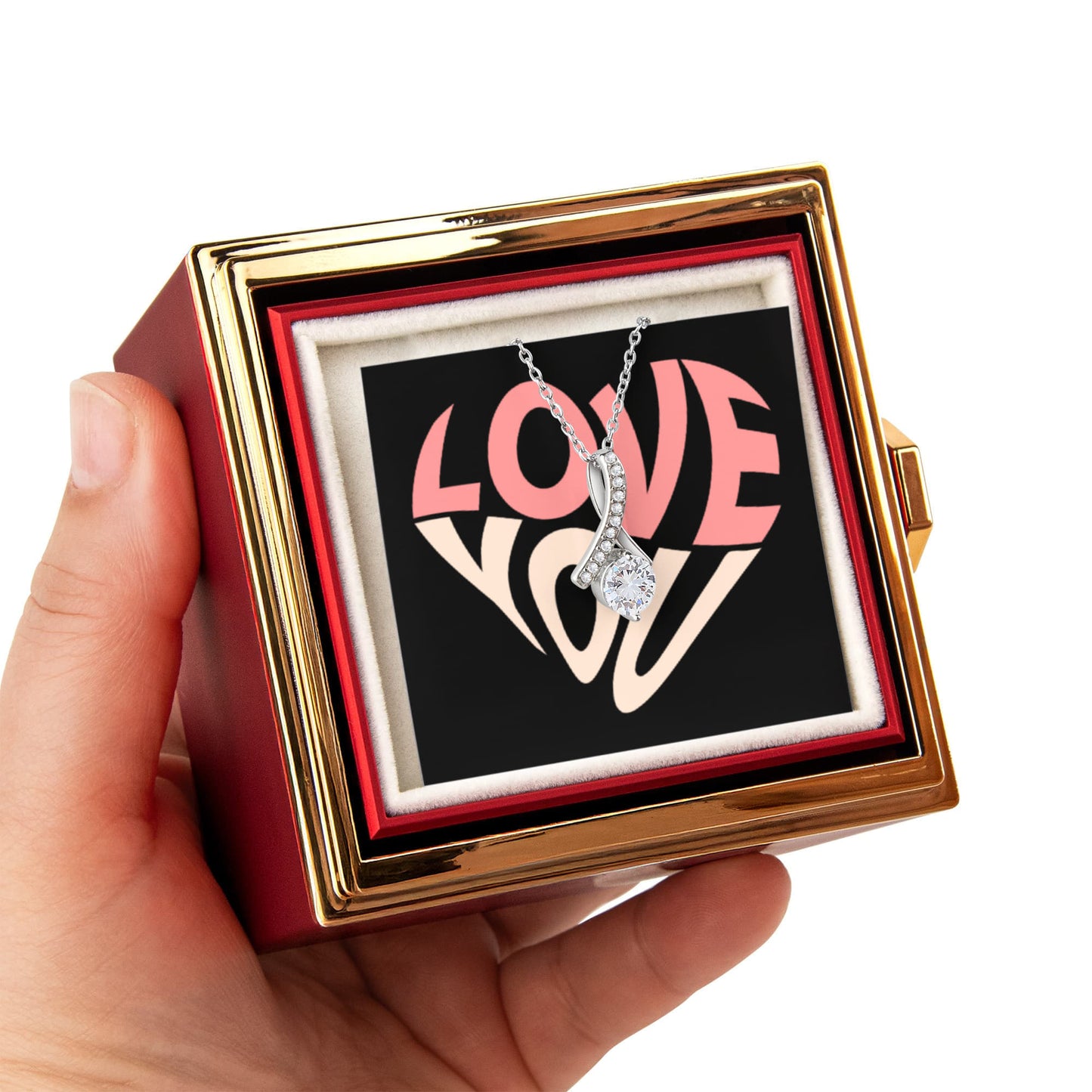 Imagine her reaction as she receives this beautiful Alluring Beauty Necklace. The luxurious box, featuring a charming preserved rose that never fades, adds an extra touch of love. With a simple turn of the gold knob, her breathtaking gift is revealed—making it the perfect sentimental gift for that special someone.
