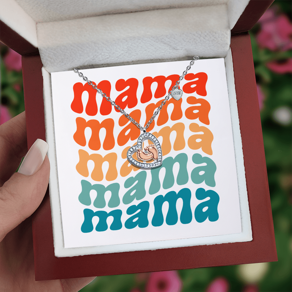 Imagine her reaction receiving this heartfelt symbol of love, family, and precious beginnings. The Baby Feet Heart Necklace features a sparkling heart-shaped frame adorned with shimmering cubic zirconia, surrounding a delicate pair of rose gold baby feet.