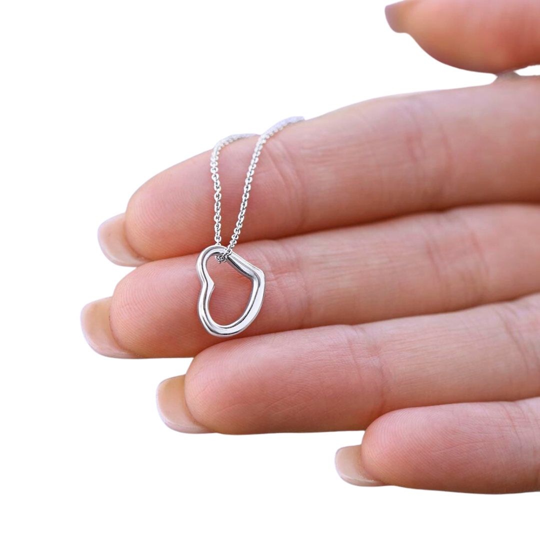 Imagine her delight when she sees this beautiful Delicate Heart Necklace, lovingly crafted in sterling silver and dipped in 14k white gold or 18k yellow gold for added luxury. This piece is pure elegance wrapped up in timeless simplicity. Trends may come and go, but this piece will last a lifetime with its classic subtle beauty.