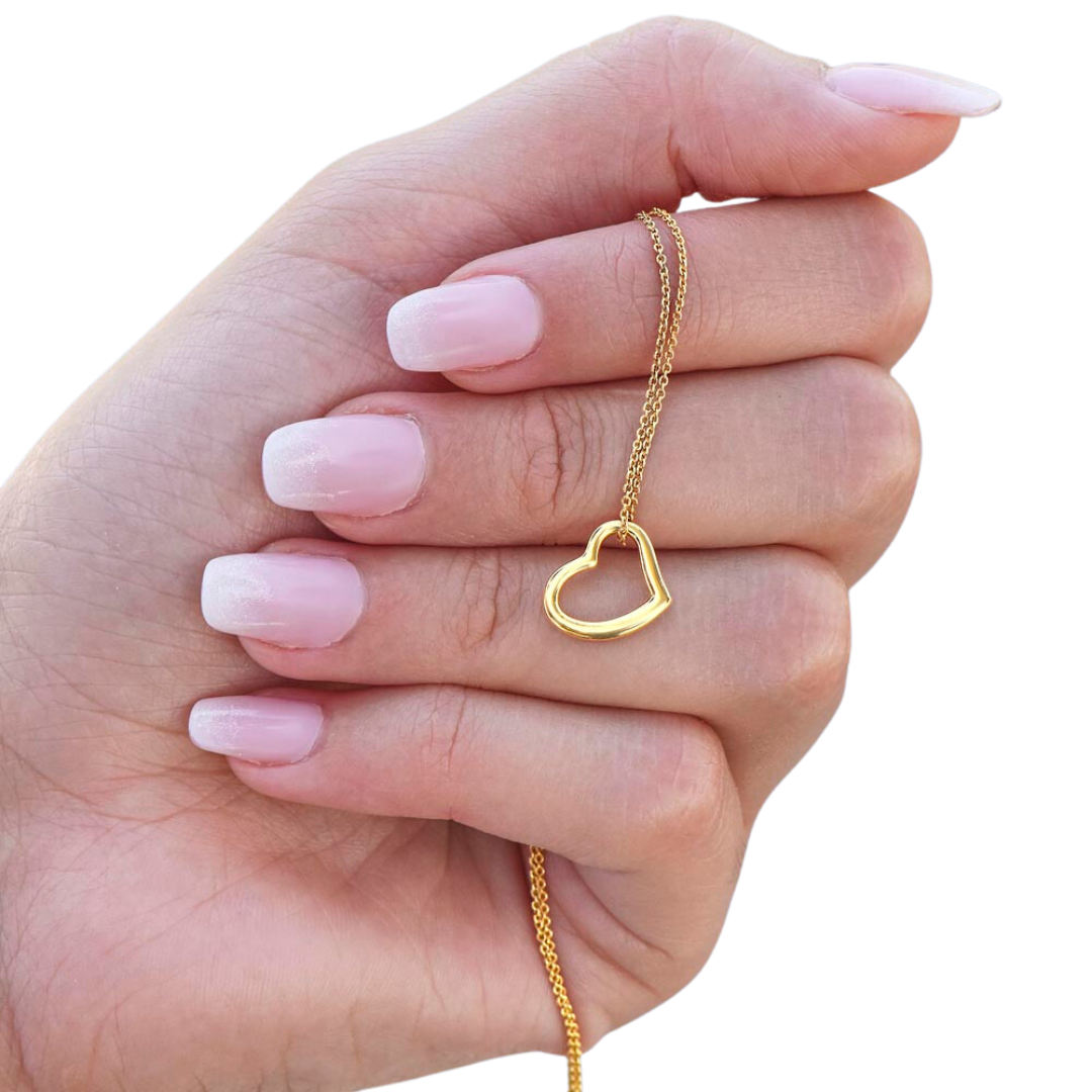 Imagine her delight when she sees this beautiful Delicate Heart Necklace, lovingly crafted in sterling silver and dipped in 14k white gold or 18k yellow gold for added luxury. This piece is pure elegance wrapped up in timeless simplicity. Trends may come and go, but this piece will last a lifetime with its classic subtle beauty.