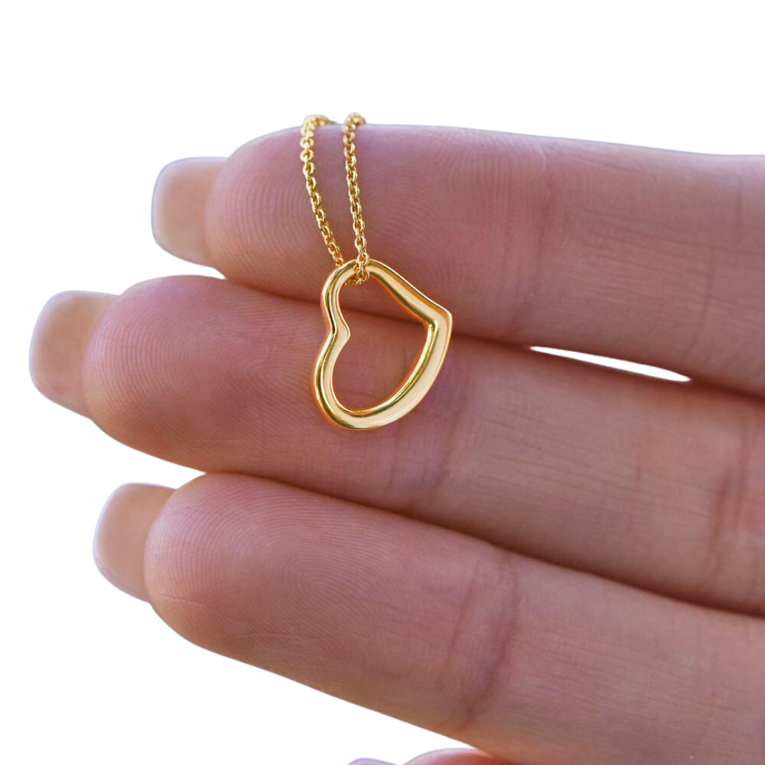 Imagine her delight when she sees this beautiful Delicate Heart Necklace, lovingly crafted in sterling silver and dipped in 14k white gold or 18k yellow gold for added luxury. This piece is pure elegance wrapped up in timeless simplicity. Trends may come and go, but this piece will last a lifetime with its classic subtle beauty.