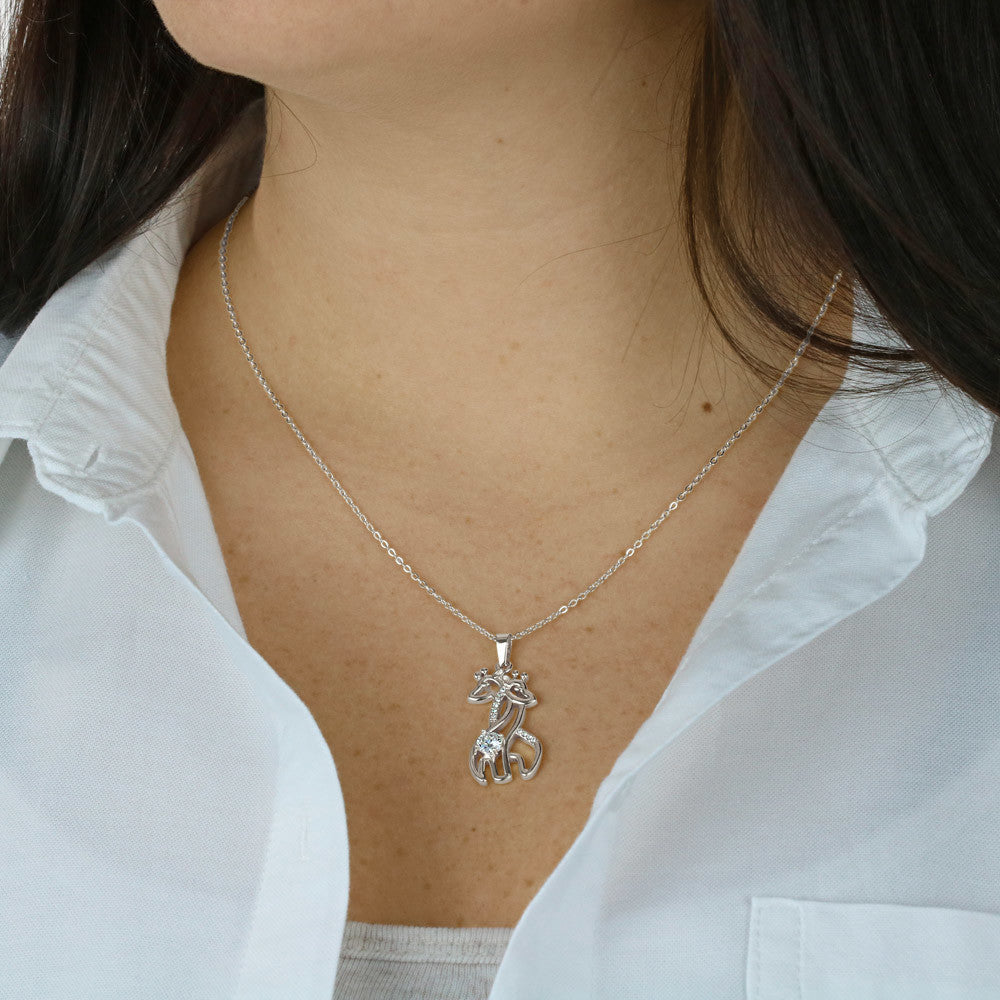 This charming Giraffe Necklace, adorned with sparkling cubic zirconia and crafted from either a 14k white gold finish or an 18k yellow gold finish, is the perfect gift and is destined to become a cherished token of your affection.