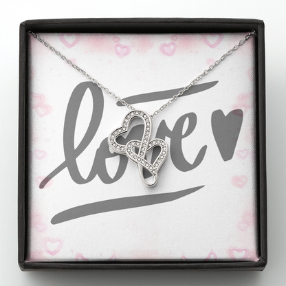 Picture the joy lighting up your loved one's face when they lay eyes on our stunning Heart-to-Heart Pendant Necklace! The intertwined hearts symbolize an unbreakable bond between two souls. Crafted with a touch of magic, this pendant boasts a 14K white gold finish and twinkles with delicate cubic zirconia crystals, adding just the right amount of sparkle. It's effortlessly elegant and elevates any outfit, making it the perfect gift for that special someone!