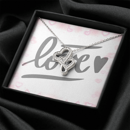 Picture the joy lighting up your loved one's face when they lay eyes on our stunning Heart-to-Heart Pendant Necklace! The intertwined hearts symbolize an unbreakable bond between two souls. Crafted with a touch of magic, this pendant boasts a 14K white gold finish and twinkles with delicate cubic zirconia crystals, adding just the right amount of sparkle. It's effortlessly elegant and elevates any outfit, making it the perfect gift for that special someone!