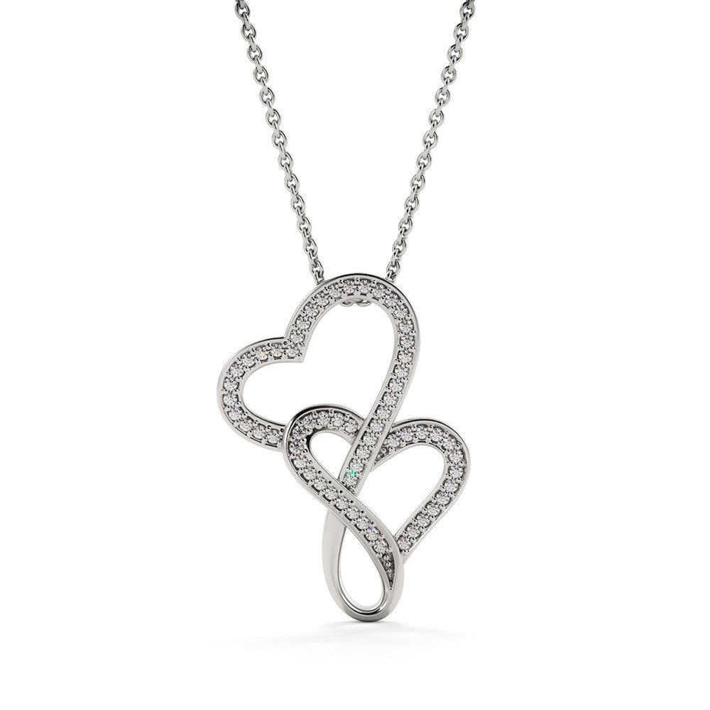 Picture the joy lighting up your loved one's face when they lay eyes on our stunning Heart-to-Heart Pendant Necklace! The intertwined hearts symbolize an unbreakable bond between two souls. Crafted with a touch of magic, this pendant boasts a 14K white gold finish and twinkles with delicate cubic zirconia crystals, adding just the right amount of sparkle. It's effortlessly elegant and elevates any outfit, making it the perfect gift for that special someone!