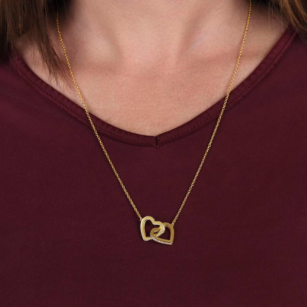 Give her the gift that symbolizes your never-ending love. Featuring two lovely hearts embellished with cubic zirconia crystals, this Interlocking Hearts necklace is the perfect accessory for everyday wear. Whether it's a memorable anniversary or a special birthday, make sure to dazzle your special someone by gifting them this stunning necklace.