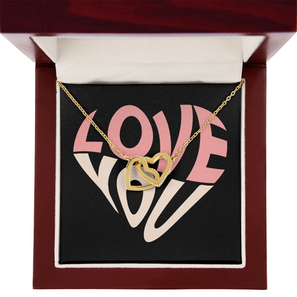 Give her the gift that symbolizes your never-ending love. Featuring two lovely hearts embellished with cubic zirconia crystals, this Interlocking Hearts necklace is the perfect accessory for everyday wear. Whether it's a memorable anniversary or a special birthday, make sure to dazzle your special someone by gifting them this stunning necklace.