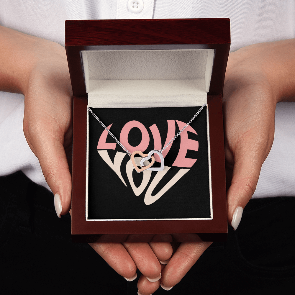 Give her the gift that symbolizes your never-ending love. Featuring two lovely hearts embellished with cubic zirconia crystals, this Interlocking Hearts necklace is the perfect accessory for everyday wear. Whether it's a memorable anniversary or a special birthday, make sure to dazzle your special someone by gifting them this stunning necklace.