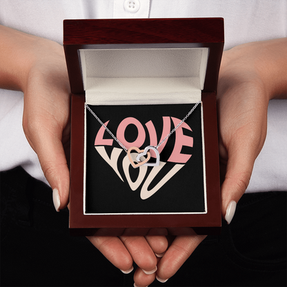 Give her the gift that symbolizes your never-ending love. Featuring two lovely hearts embellished with cubic zirconia crystals, this Interlocking Hearts necklace is the perfect accessory for everyday wear. Whether it's a memorable anniversary or a special birthday, make sure to dazzle your special someone by gifting them this stunning necklace.