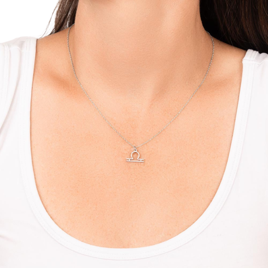 Libra Zodiac Name Necklace. Handcrafted with care, this piece is made from durable stainless steel and optionally dipped in 18k yellow gold and features her unique astrological sign.