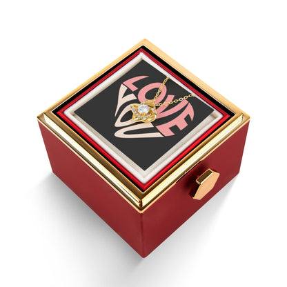 Imagine her reaction as she receives this beautiful Love Knot Necklace. Representing an unbreakable bond between two souls, this stunning pendant is adorned with premium cubic zirconia crystals, making it a timeless symbol of love and devotion. The luxurious box, featuring a meticulously preserved rose that never fades, adds an extra touch of love. With a simple turn of the gold knob, her breathtaking gift is revealed—making it the perfect sentimental gift for that special someone.