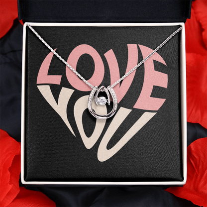 Hand crafted details make this necklace a stand out. This versatile necklace is dipped in white gold and set with shimmering crystals. A dancing center Cubic Zirconia is suspended from two fine points and is designed so as to not touch the skin but continually move in a vibrating fashion.