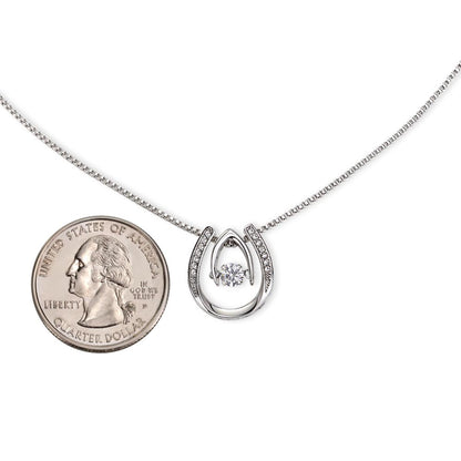 Hand crafted details make this necklace a stand out. This versatile necklace is dipped in white gold and set with shimmering crystals. A dancing center Cubic Zirconia is suspended from two fine points and is designed so as to not touch the skin but continually move in a vibrating fashion.