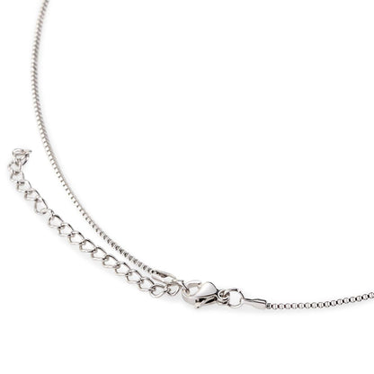 Hand crafted details make this necklace a stand out. This versatile necklace is dipped in white gold and set with shimmering crystals. A dancing center Cubic Zirconia is suspended from two fine points and is designed so as to not touch the skin but continually move in a vibrating fashion.