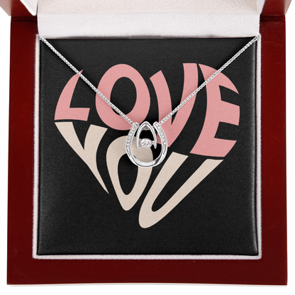 Hand crafted details make this necklace a stand out. This versatile necklace is dipped in white gold and set with shimmering crystals. A dancing center Cubic Zirconia is suspended from two fine points and is designed so as to not touch the skin but continually move in a vibrating fashion.