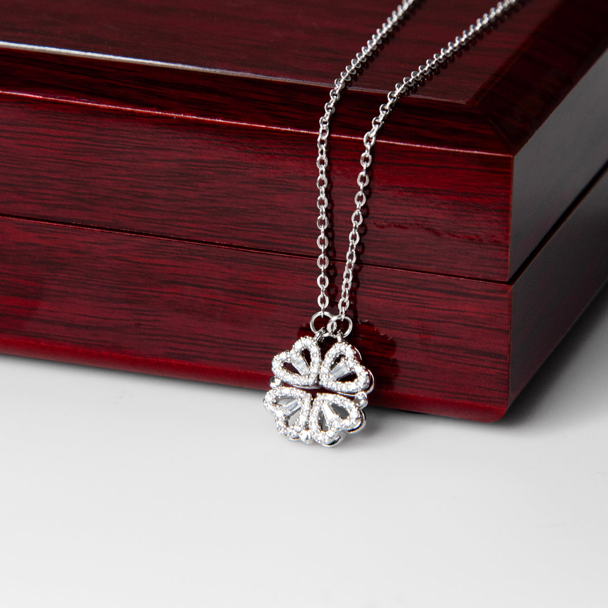 The Magnetic Hearts Necklace features four crystal-embellished hearts that come together to form a beautiful lucky clover. The hidden magnetic design allows each heart to connect seamlessly—symbolizing connection, unity, and the moments that bring us together.