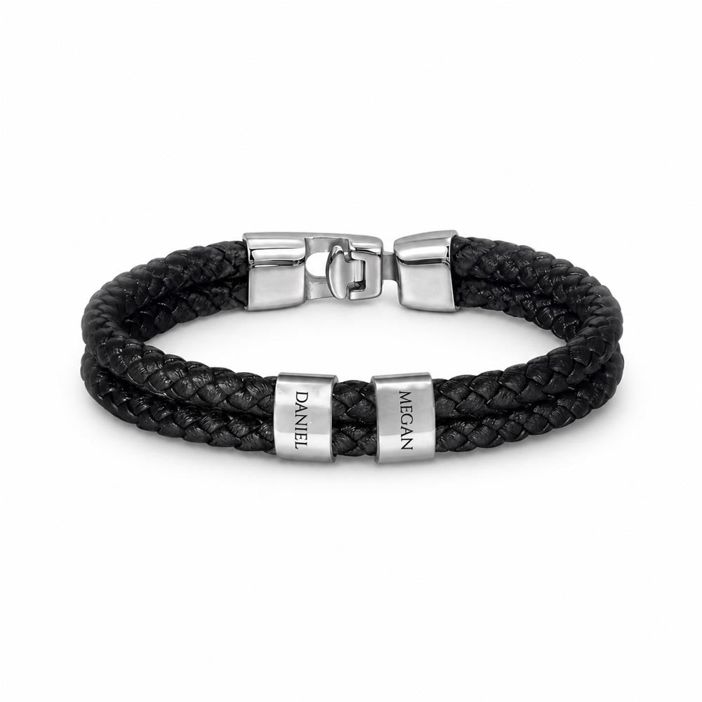 Whether it's for a milestone anniversary, a first Father’s Day, or just because—this bracelet says everything you feel, beautifully.
The Mens Personalized Name Bracelet is a sophisticated tribute to the bonds that matter most. At its center, custom-engraved beads sit nestled against a rugged, double-strand braided band.
