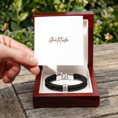 Whether it's for a milestone anniversary, a first Father’s Day, or just because—this bracelet says everything you feel, beautifully.
The Mens Personalized Name Bracelet is a sophisticated tribute to the bonds that matter most. At its center, custom-engraved beads sit nestled against a rugged, double-strand braided band.