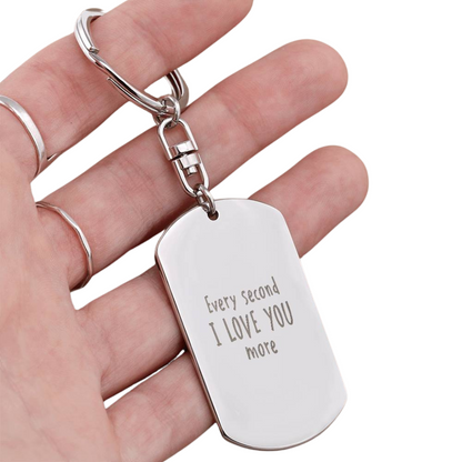 Create a unique keepsake with our Engraved Dog Tag Keychain. This high-quality stainless steel piece can be customized on the back in a scripted font, with 2 lines of text, up to 20 characters each.