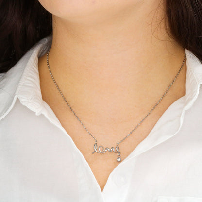 This dainty necklace leaves no doubt in her mind about your true feelings. Beautifully crafted, this adorable design spells out the word "love" in a playful cursive font.
