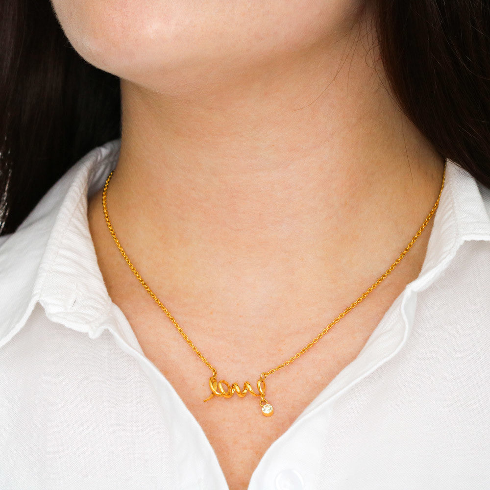 This dainty necklace leaves no doubt in her mind about your true feelings. Beautifully crafted, this adorable design spells out the word "love" in a playful cursive font.