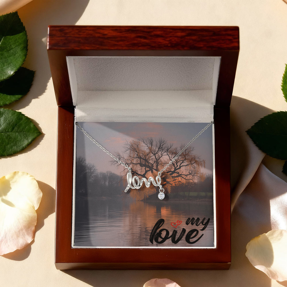 This dainty necklace leaves no doubt in her mind about your true feelings. Beautifully crafted, this adorable design spells out the word "love" in a playful cursive font.