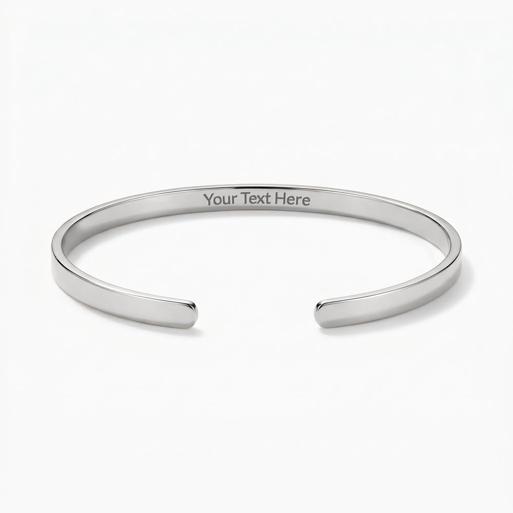 Sleek, modern, and effortlessly sophisticated. The Custom Engraved Cuff Bracelet is a timeless way to keep your most cherished memories, names, or meaningful dates close at hand.