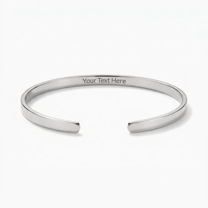 Sleek, modern, and effortlessly sophisticated. The Custom Engraved Cuff Bracelet is a timeless way to keep your most cherished memories, names, or meaningful dates close at hand.
